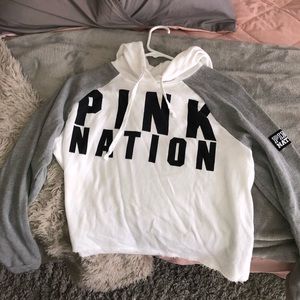 a pink cropped hoodie